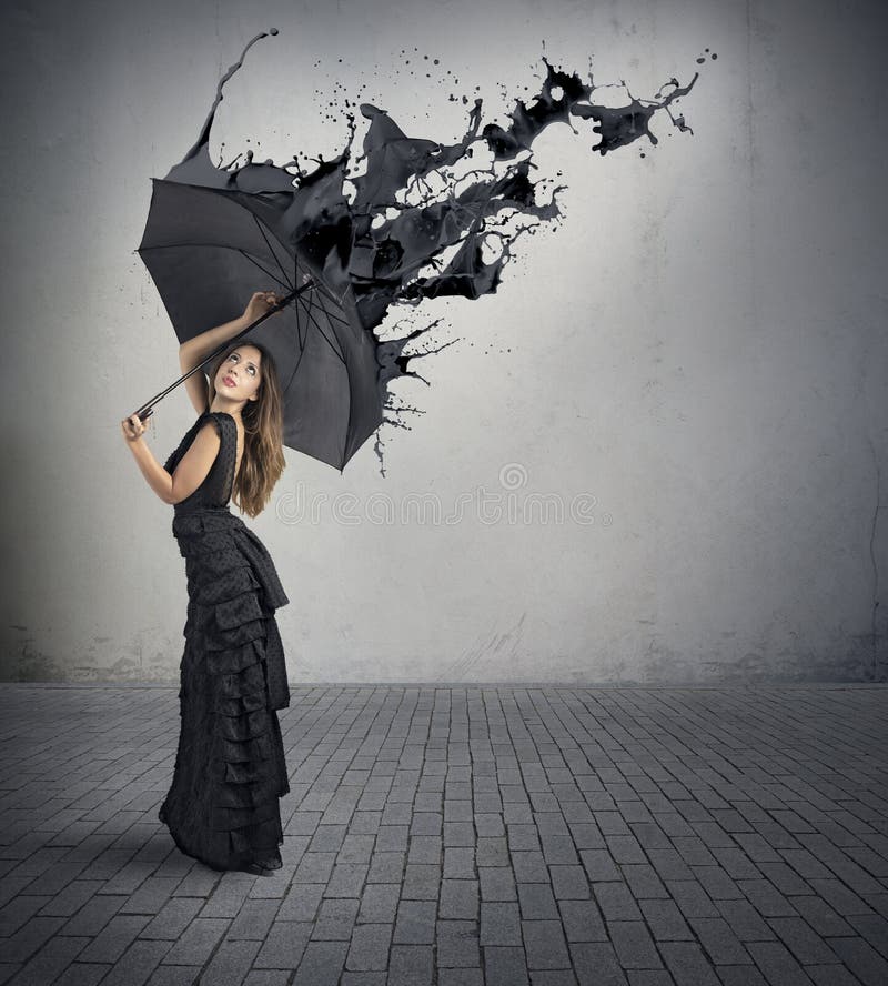 Concept of black color splash with girl holding umbrella