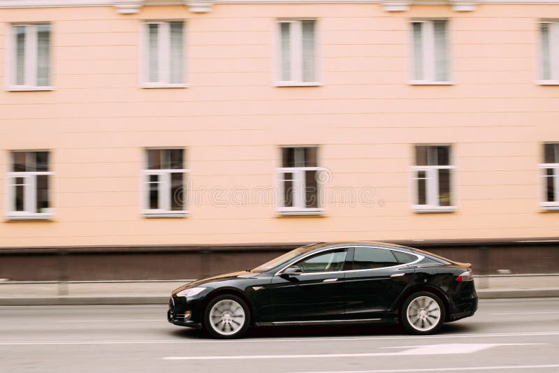 Black Color Tesla Model S Car In Motion On Street. The Tesla Model S