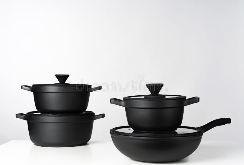Black Cooking Pots on Grey Background Front View Stock Image Image of