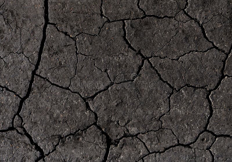 Black cracked ground texture background