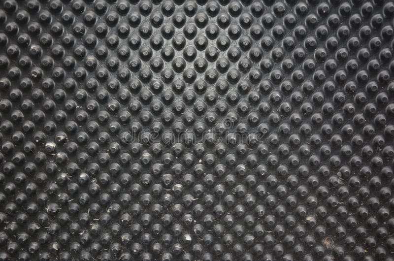 A black dimpled waterproofing foundation or basement membrane background. Water and moisture protection stock image
