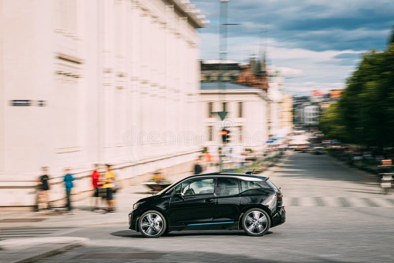 Oslo, Norway - June 24, 2019: Black electric BMW i3 is a B-class, high-roof hatchback Fast Driving In City Street.