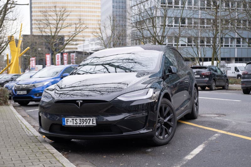 Black electric car tesla, Model X parked on street, popular Elektro-SUV from company Elon Musk, alternative energy development, clean energy, ev innovation, Frankfurt, Germany - February 10, 2024. Development ev stock images, royalty-free photos and pictures