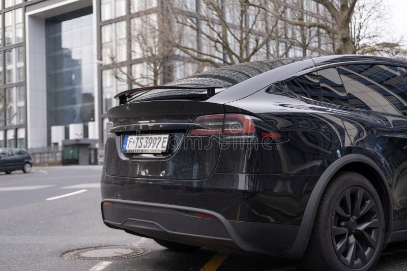 Black electric car tesla, Model X parked on street, popular Elektro-SUV from company Elon Musk, alternative energy development, clean energy, ev innovation, Frankfurt, Germany - February 10, 2024. Development ev stock images, royalty-free photos and pictures