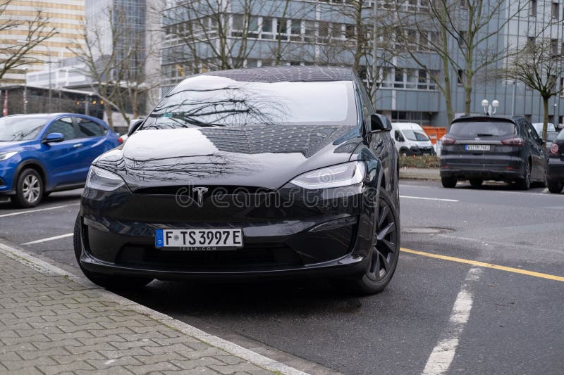 Black electric car tesla, Model X parked on street, popular Elektro-SUV from company Elon Musk, alternative energy development, clean energy, ev innovation, Frankfurt, Germany - February 10, 2024. Development ev stock images, royalty-free photos and pictures