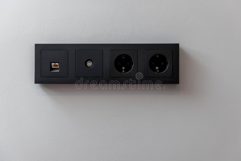 A black electrical box with four outlets royalty free stock photos
