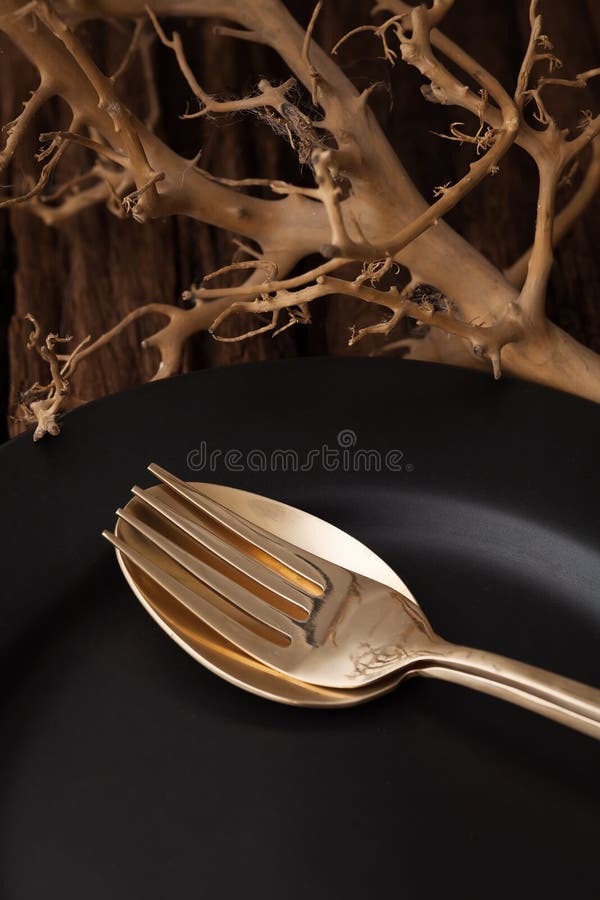 Black empty plate fork spoon on wooden table background royalty free stock image