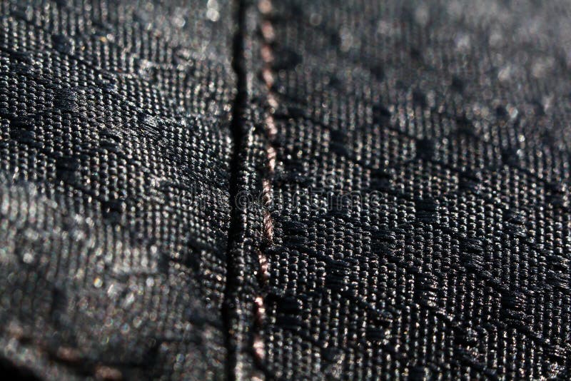 Black fabric texture background. Detail of canvas textile material.