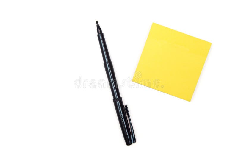 Black felt-tip pen near yellow sticky note. royalty free stock photo Black felt-tip pen near yellow sticky note. royalty free stock photo