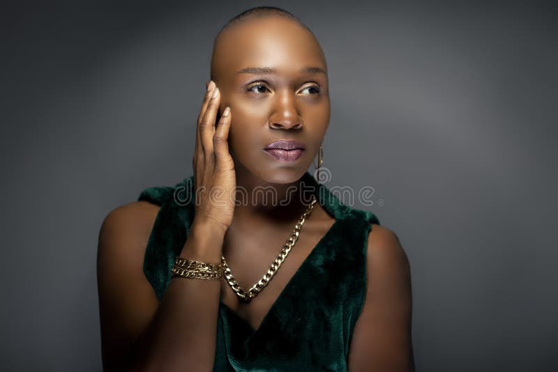 Black Female Fashion Model with Bald Hairstyle Looking Confident and Bold  Stock Image - Image of glamour, ebony: 147782245
