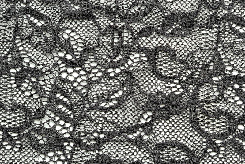 Black flower lace material texture macro shot