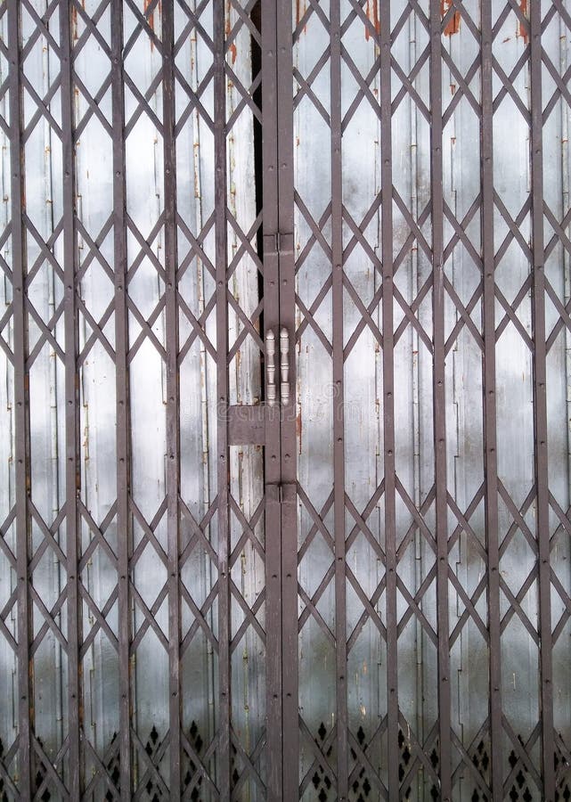 Black folding steel door stock image. Image of entrance 100401525