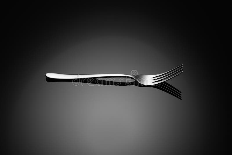 Black food background with fork stock image Black food background with fork stock image