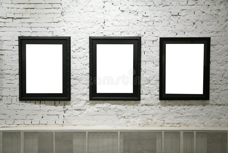 Black frames on white brick wall