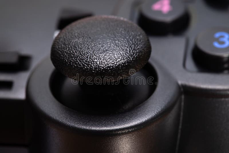 Black game joystick on white background close-up stock photos