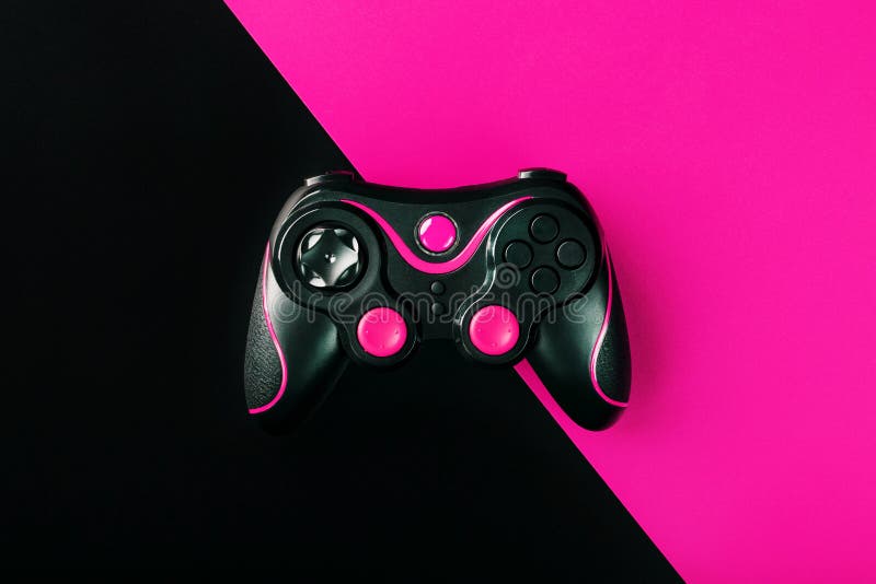 Black Gamepad on Black and Pink Background. Game Concept. Device ...