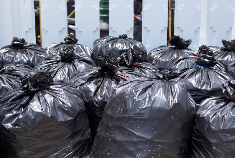 Garbage bags. Waste, black garbage bags plastic pile stack. Lots pile of garbage  bags stack. by KYNA STUDIO. Photo stock - StudioNow