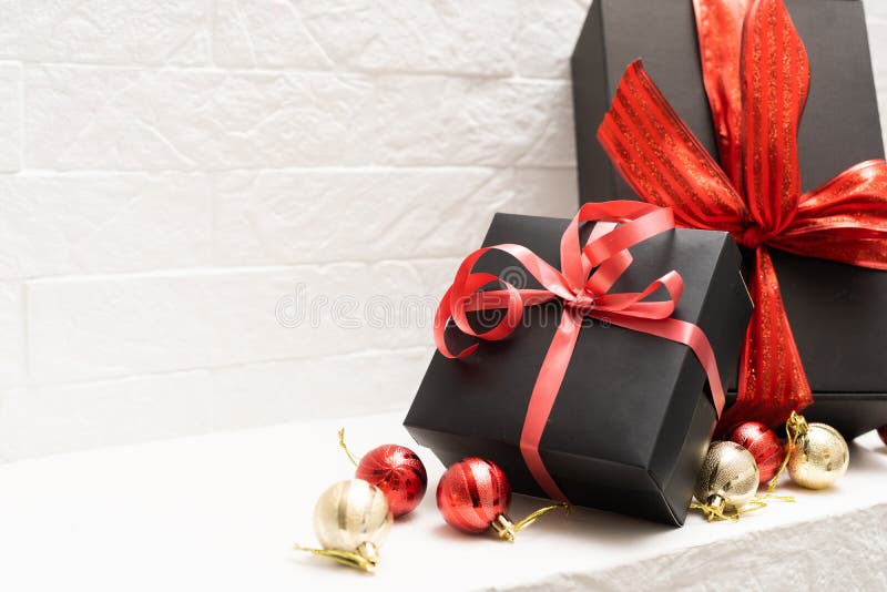 Black Gift Box with Red Bow and Ribbons on a White Background Stock ...