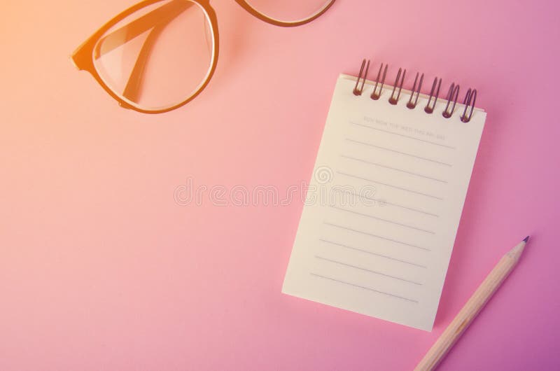 Black glasses and empty page notebook business woman schedule concept background stock photography