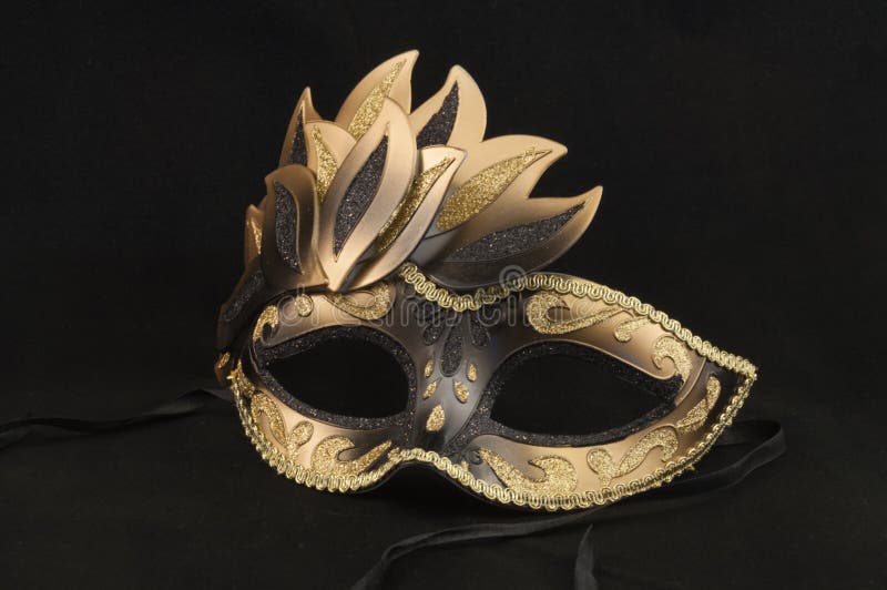 Ballroom Masquerade Mask decorated with black and gold accents. Ballroom Masquerade Mask decorated with black and gold accents.