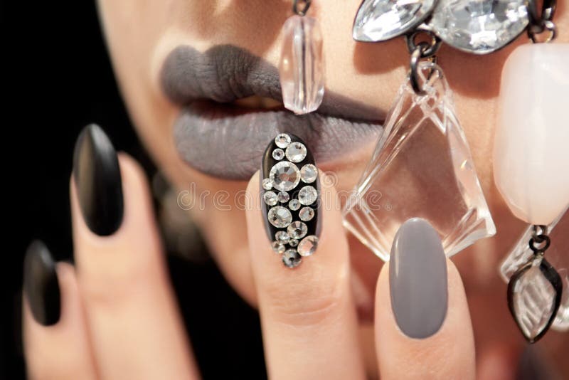 Black gray glam matte makeup and manicure royalty free stock photo