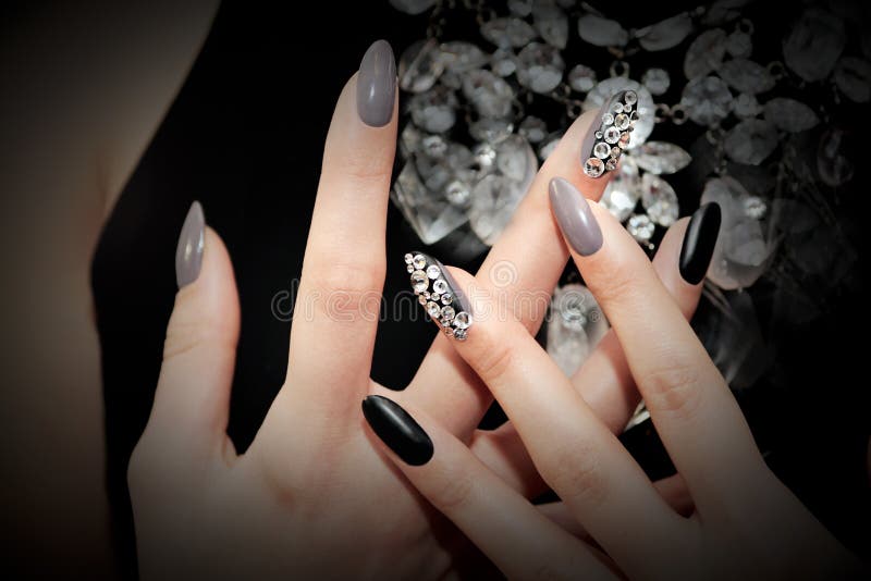 Black gray glam matte manicure stock images