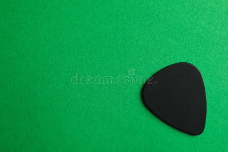 Black Guitar Pick On Color Background Stock Image Image of