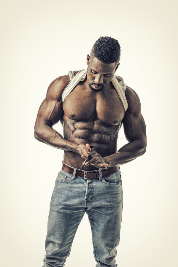 hard workout. Muscular black man doing exercises with dumbbells