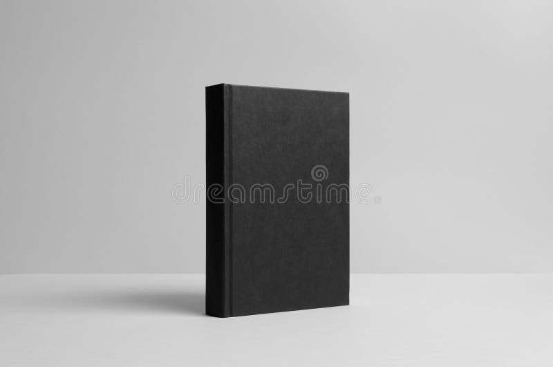 Black Hardcover Book Mock-Up - Wall Background stock photo