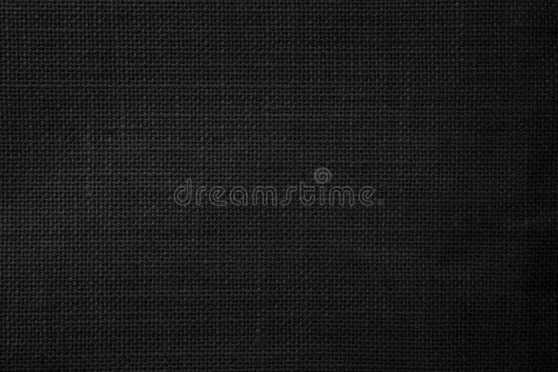 Black Hemp rope texture background. Haircloth wale black dark cloth wallpaper. Rustic sackcloth canvas fabric texture in natural.