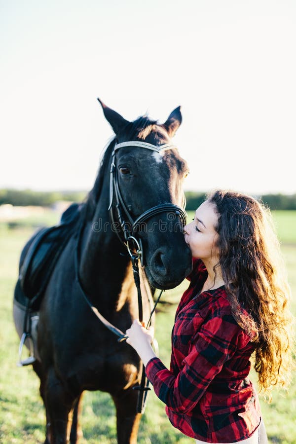 Black Horse Kissed by a Young Woman. Stock Photo - Image of friendship, love:  119882212