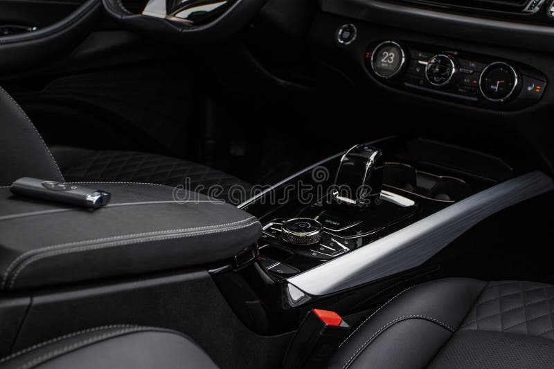 Black Interior of a Modern Car. Focused on Hift Lever and Dashboard