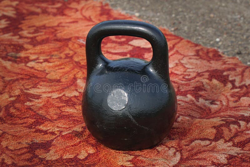 Black kettlebell with handle stock photography Black kettlebell with handle stock photography
