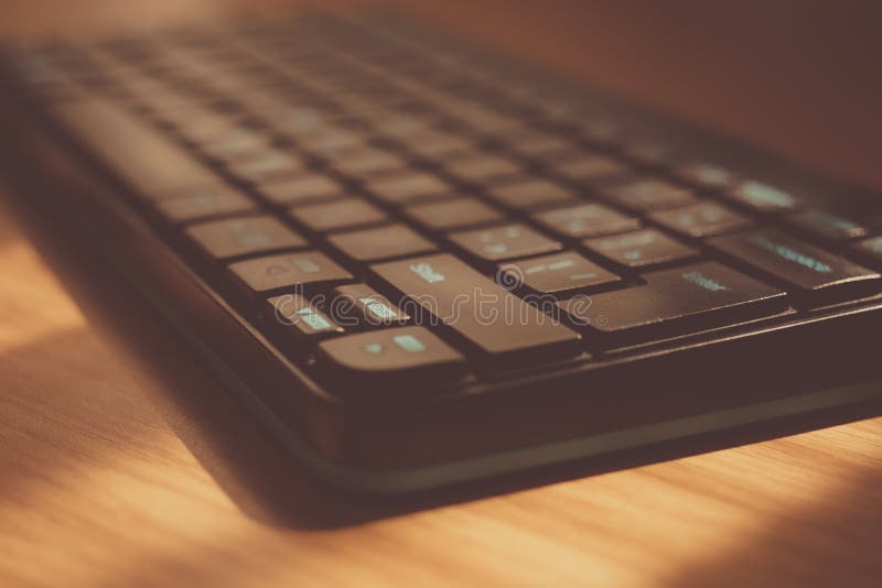 Black Keyboard on the Table Closeup. Focus on Key Enter Stock Photo