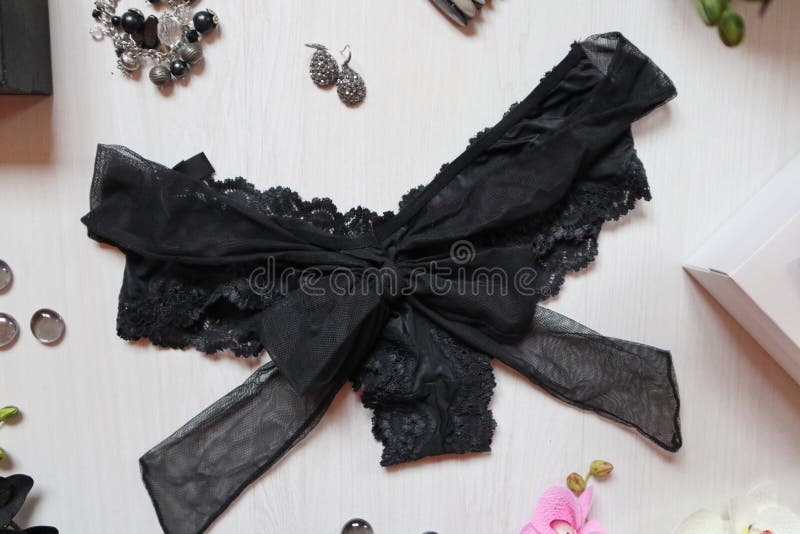 Black Lace Panties with Big Bow on a White Background. Women`s a