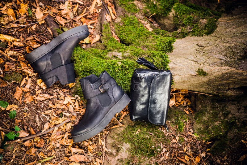 Black Leather Boots and Black Handbag on Moss, Female Soda Stock Image ...