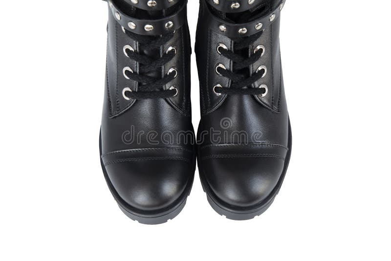 Black leather fashion shoes with metal knobs on white background stock images