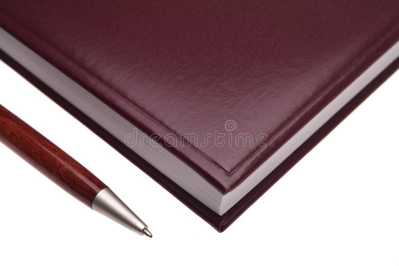 Black leather notebook and pen royalty free stock image