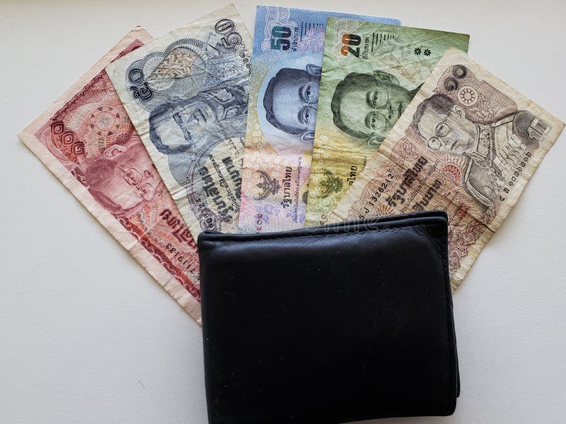 black leather wallet and thai banknotes stock image black leather wallet and thai banknotes stock image