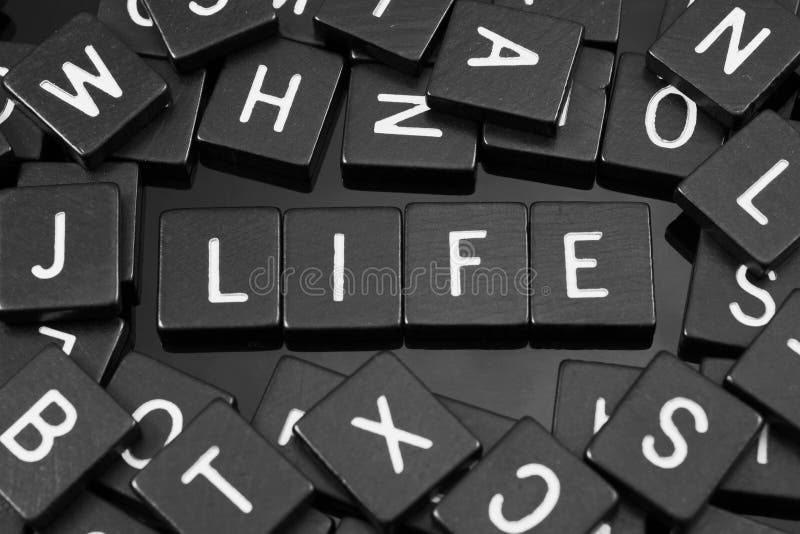 Black Letter Tiles Spelling the Word & X22;life& X22; Stock Photo