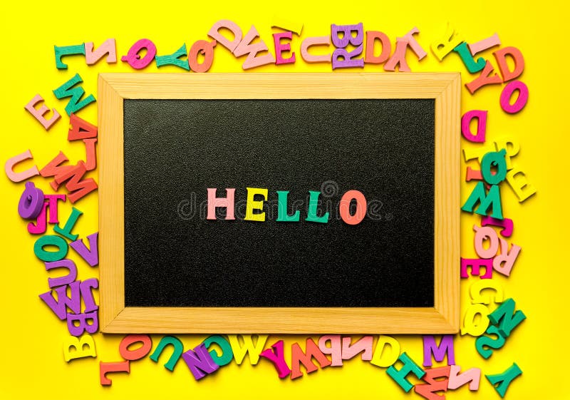 Black Letterboard with Wooden Letters on Yellow Background Stock Photo