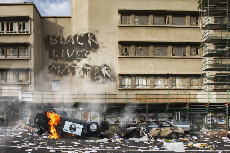 Black Lives Matter protest riot vandalism, looting aftermath concept, flaming police car smashed, overturned with black lives