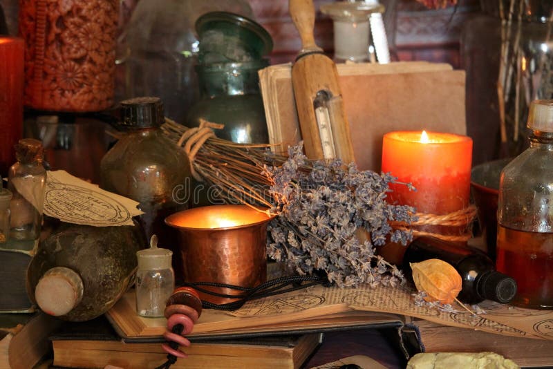 Still life Witchcraft composition with candles, crystal, magic book and pentagram symbol. Halloween and occult concept, black magic ritual. Still life Witchcraft composition with candles, crystal, magic book and pentagram symbol. Halloween and occult concept, black magic ritual.