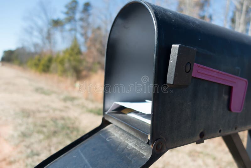 Black mail box and post office mail with blue sky stock photo