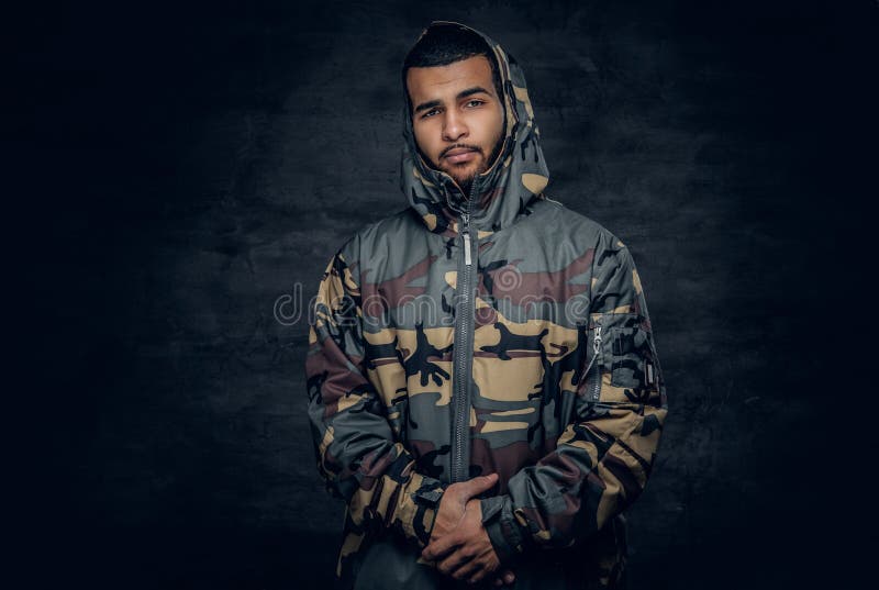 Rapper In Camouflage Jacket With Ribbon Stands On Tiptoes Stock Image