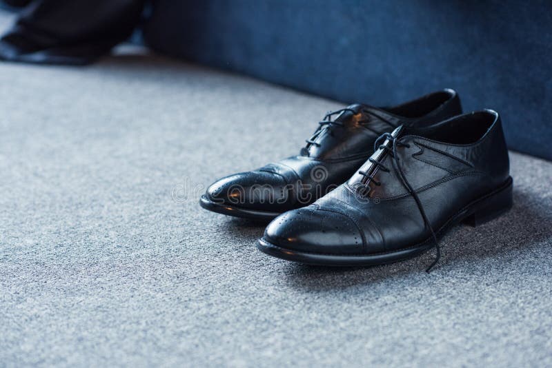 Black Male Leather Shoes on Floor in Bedroom with Business Suit Placed ...