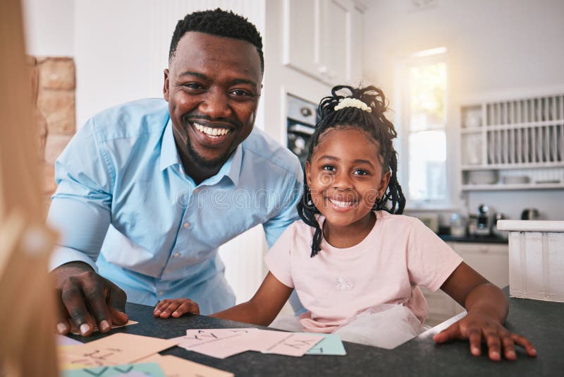 Black man, girl and education, portrait and happy, father helping child with school work at kitchen table. Teaching