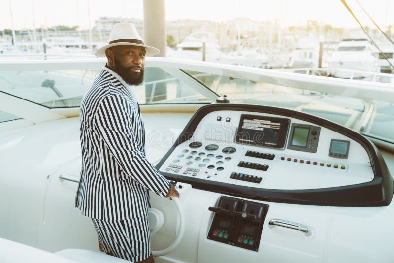 black man on yacht