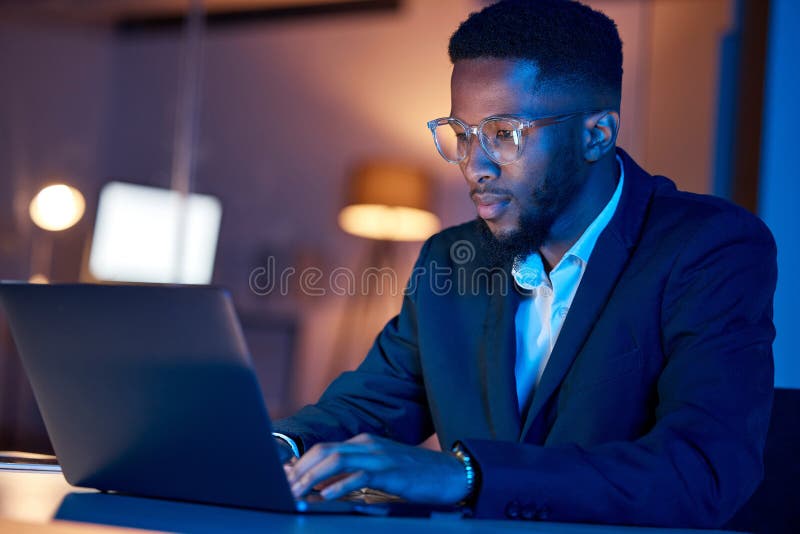 Black man, laptop and typing, businessman focus with coding or writing report, information technology and data analysis stock images