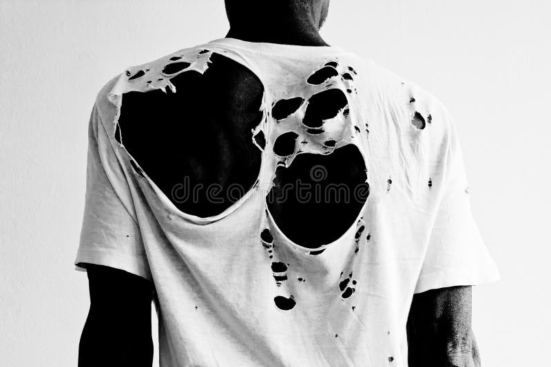 Back of a man wearing a torn white t-shirt